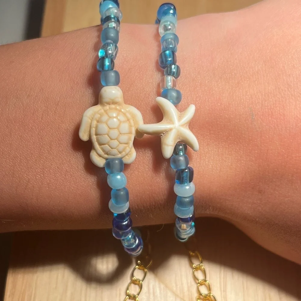 Handmade pack of matching blue beaded bracelets beach theme gold turtle starfish